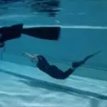 Deep Blue diver with spear in pool