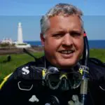 Diving Enthusiast at Coastal Lighthouse