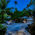Tropical outdoor dining area at sunset