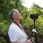 Deep Blue researcher with camera in nature