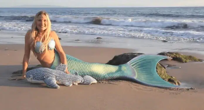 Mermaid Linden showcasing her custom mermaid tail during a Kickstarter campaign.