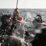 Swimmers in open water during a diving training session