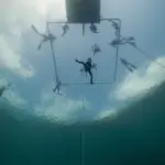 Underwater drone exploration with multiple divers and equipment