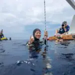 Deep Blue Diver Celebrates Underwater Achievement
