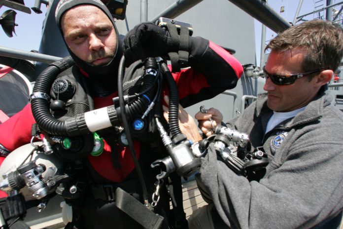 Deep diver Richie Kohler getting suited up to dive the Britannic. (Photo credit: richiekohler.com)