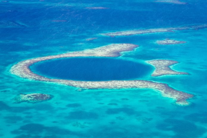 Aerial view of the great blue hole of the coast of Belize