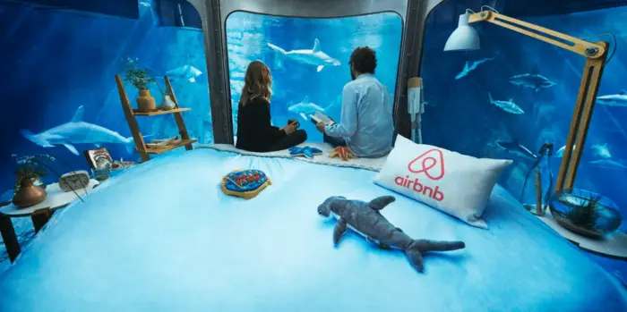 Airbnb is offering three lucky winners a chance to spend the night with sharks at the Paris Aquarium.