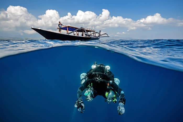 Technical Diving - a mix gas Technical Diver under a dive boat