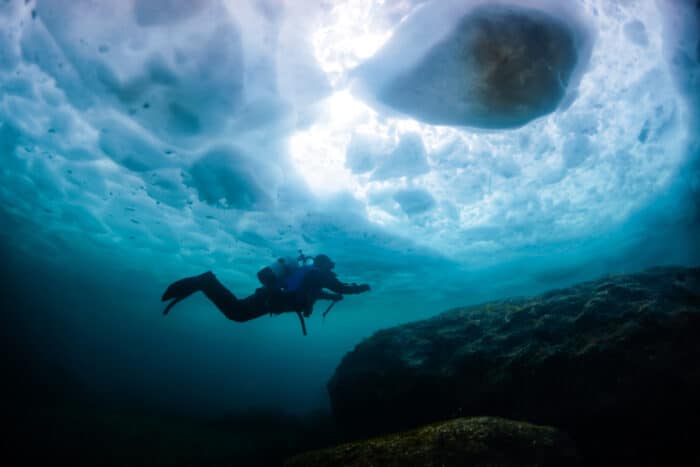 A Scuba diver who is Ice Diving