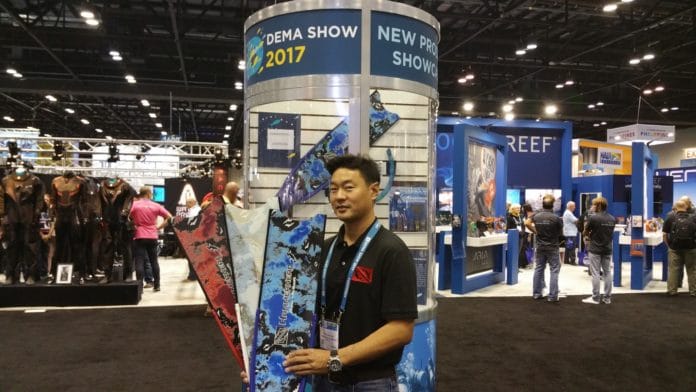 Kevin Sakuda displays Hammerhead's new colorful fins