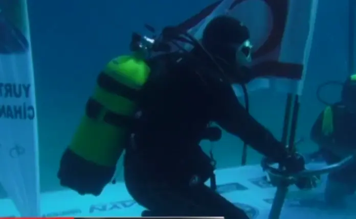 Turkish Diver Cem Karabay sets new cold water endurance record