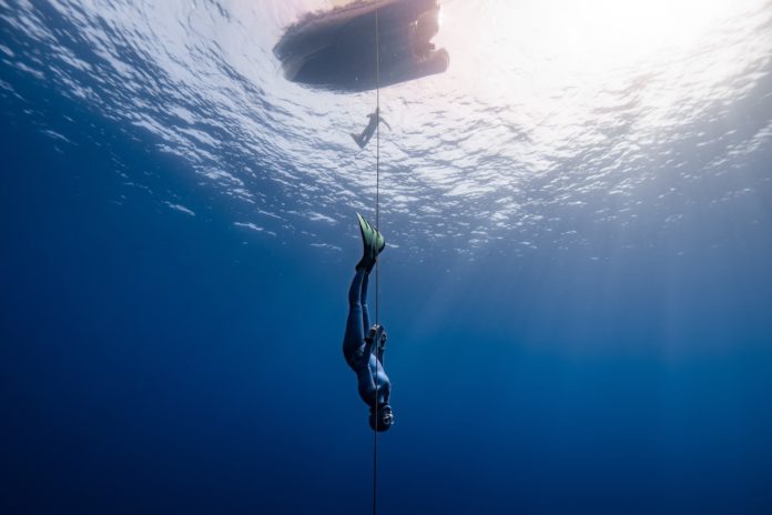 UK National Record Holder Georgina Miller descends into infinite blue