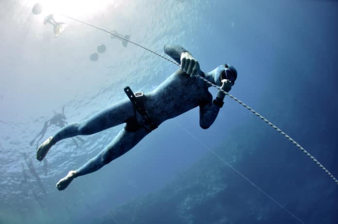 Freediver makes preparation dive in Blue Hole, Dahab, Egypt