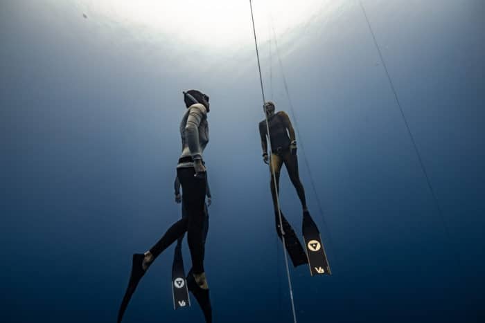 Enchante Gallardo of Hawaii is escorted up by the safety team (photo by Daan Verhoeven)