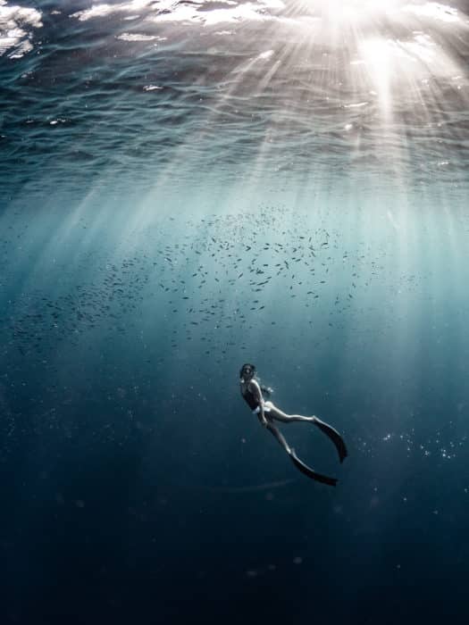 In this image the light was low just before sunset. The diver was between me and the low sun. By shooting in this way we get strong contrast on the subject and epic light beams.