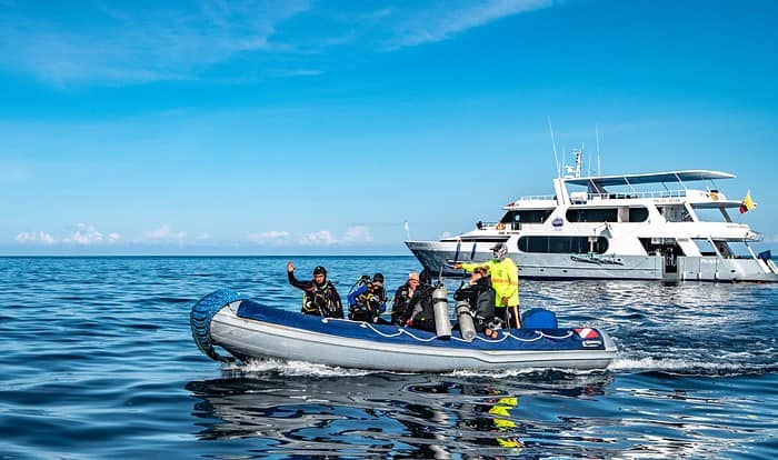 Galapagos Aggressor II and Guests at Isla Fernandina. Photo By Mark B. Hatter