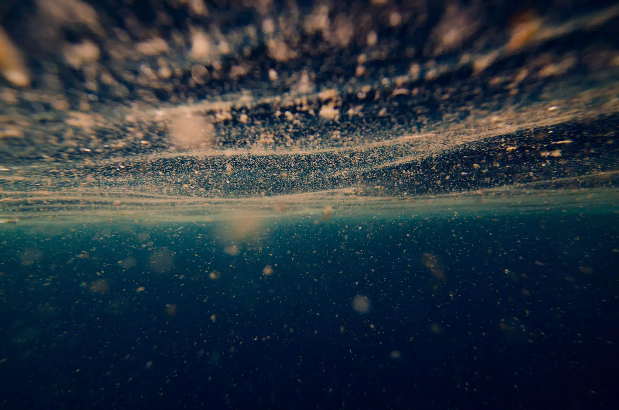 abstract underwater background with plankton (Adobe Stock)