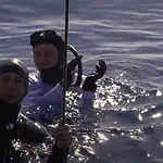 Deep blue diving team in open water
