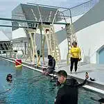Swimmers preparing for training at aquatic center