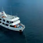 Luxury yacht sailing in open sea for diving adventures