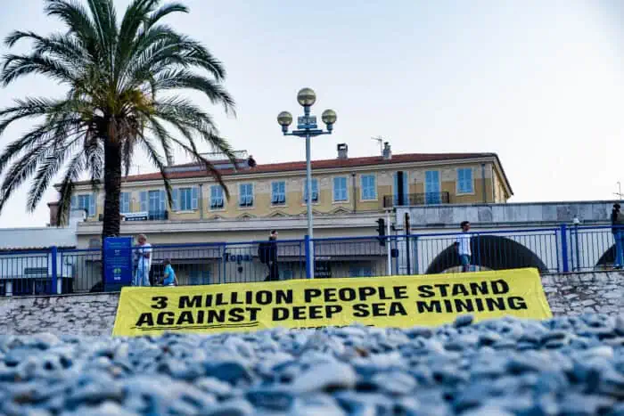 Greenpeace banner protesting against deep sea mining during UNOC3.