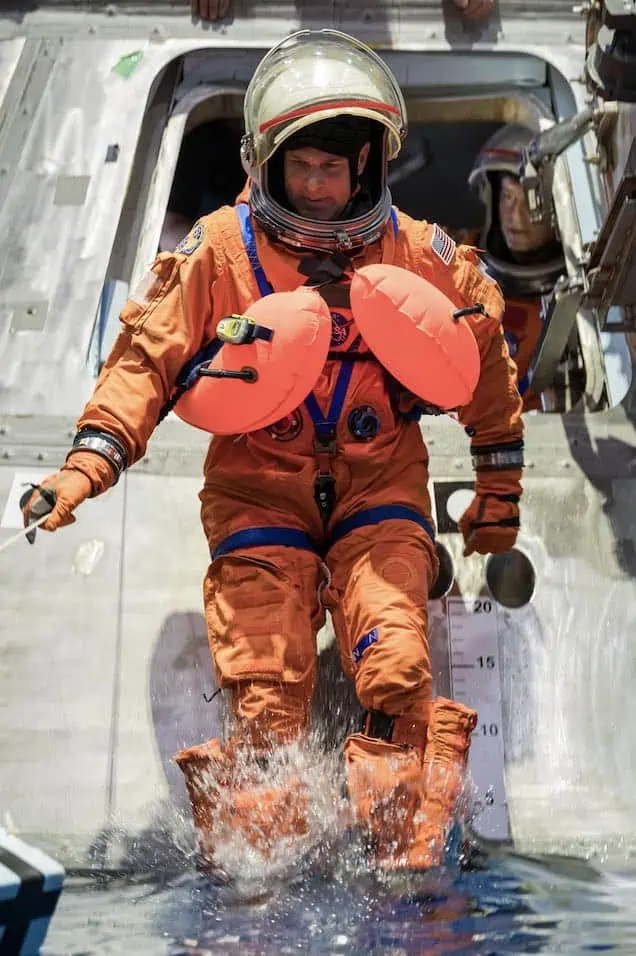Artemis II crew member and Canadian Space Agency astronaut Jeremy Hansen exits a mockup of the Orion spacecraft during a training exercise in the Neutral Buoyance Lab at NASA’s Johnson Space Center in Houston, January 23. (Image credit: Omni Measurement Systems)